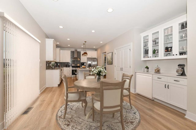 dining room with light wood-type flooring