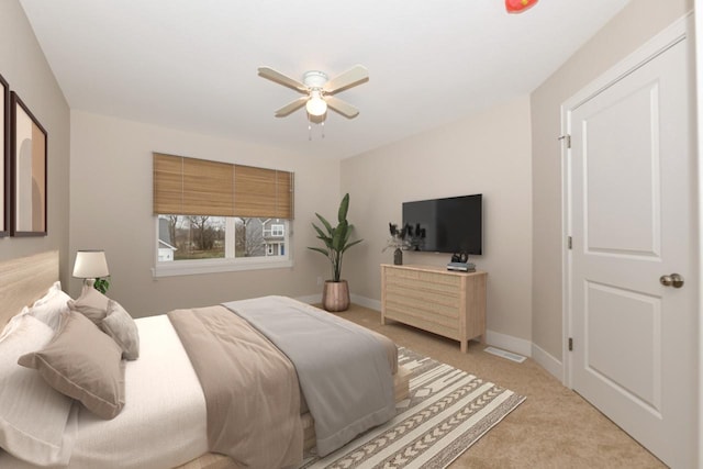 bedroom featuring light colored carpet and ceiling fan