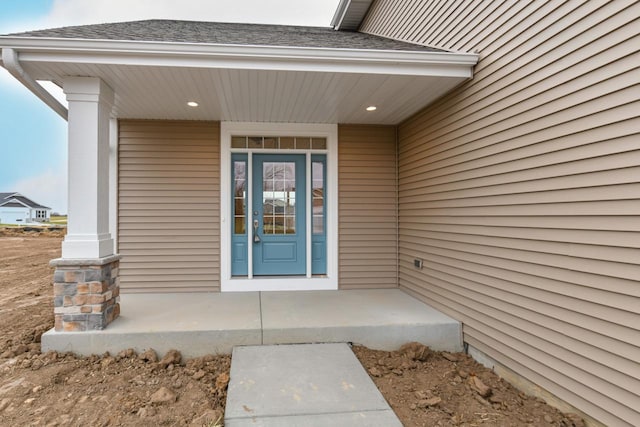 property entrance with covered porch