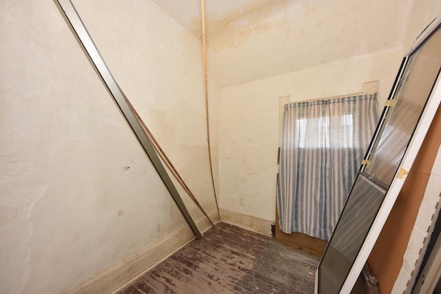 bathroom with wood-type flooring