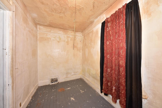 empty room featuring wood-type flooring