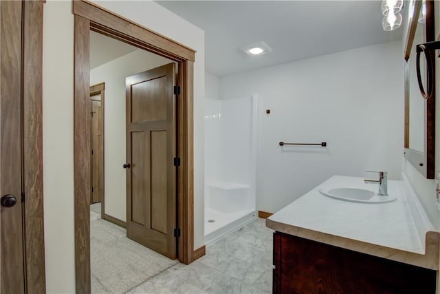 1319 Carli Ct Lot 80, Chippewa Falls, WI 54729 - bathroom featuring a shower stall, vanity, baseboards, and marble look tile flooring