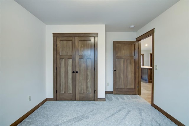 1319 Carli Ct Lot 80, Chippewa Falls, WI 54729 - bedroom featuring baseboards, a closet, and light colored carpet