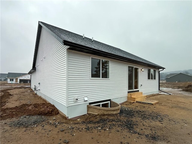 1319 Carli Ct Lot 80, Chippewa Falls, WI 54729 - back of house featuring entry steps and a shingled roof
