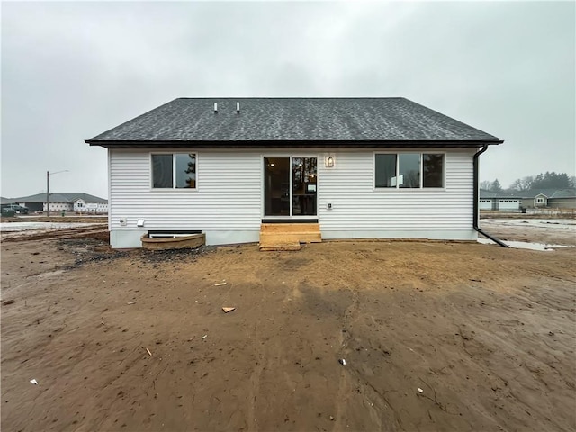 1319 Carli Ct Lot 80, Chippewa Falls, WI 54729 - back of house featuring entry steps and a shingled roof