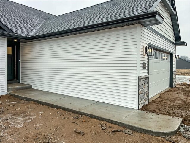 1319 Carli Ct Lot 80, Chippewa Falls, WI 54729 - view of home's exterior featuring roof with shingles and a garage