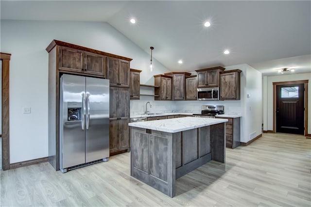 1319 Carli Ct Lot 80, Chippewa Falls, WI 54729 - kitchen with appliances with stainless steel finishes, a sink, vaulted ceiling, dark brown cabinetry, and light wood-style floors