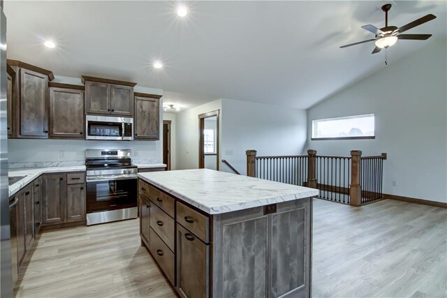 1319 Carli Ct Lot 80, Chippewa Falls, WI 54729 - kitchen featuring appliances with stainless steel finishes, a kitchen island, ceiling fan, light wood finished floors, and dark brown cabinetry