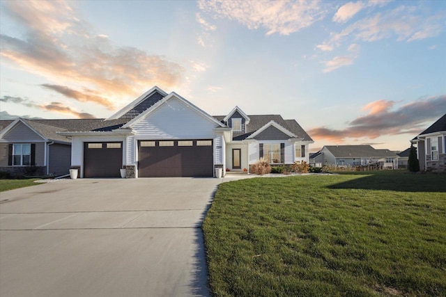 7759 Sunstone Ct, De Pere, WI 54115 - view of front facade with a garage, concrete driveway, a front lawn, and stone siding