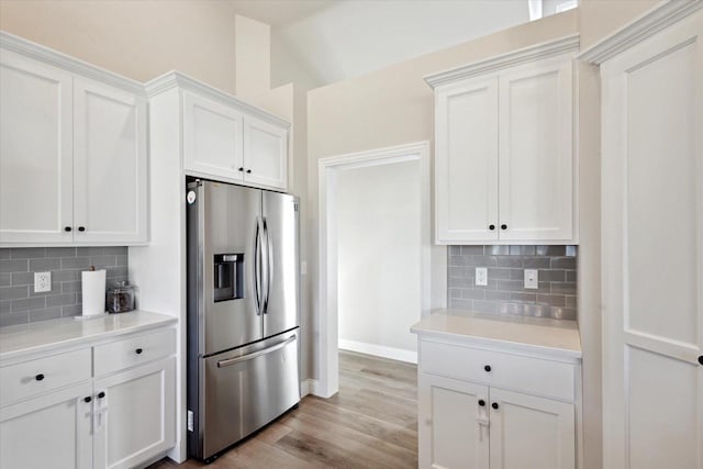 7759 Sunstone Ct, De Pere, WI 54115 - kitchen featuring stainless steel refrigerator with ice dispenser, light countertops, and tasteful backsplash