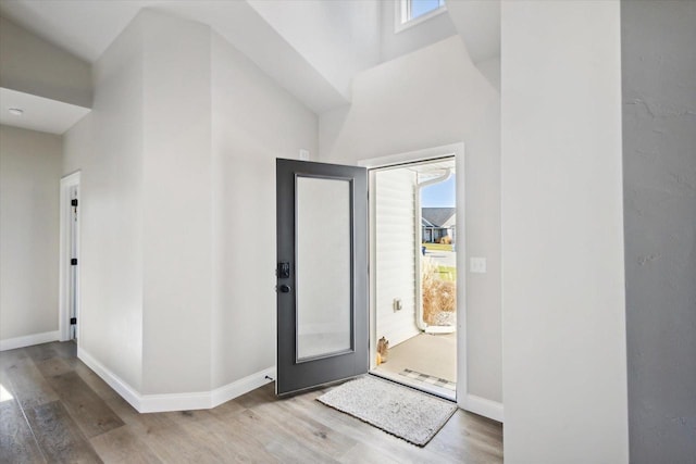 7759 Sunstone Ct, De Pere, WI 54115 - foyer featuring wood finished floors, baseboards, and a towering ceiling