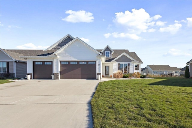 7759 Sunstone Ct, De Pere, WI 54115 - craftsman-style house featuring driveway, a garage, a front yard, and stone siding