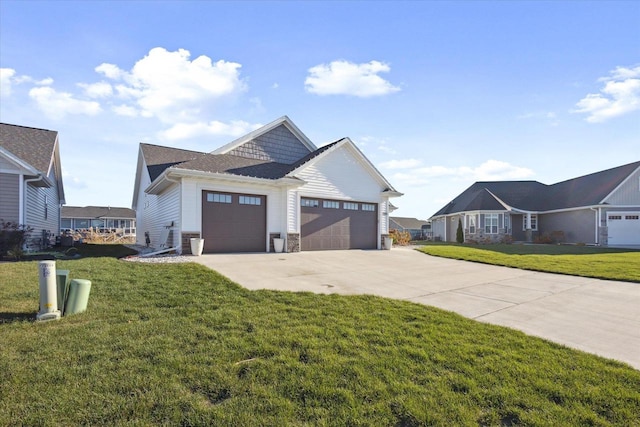 7759 Sunstone Ct, De Pere, WI 54115 - view of front of home with a garage, concrete driveway, a front lawn, and stone siding