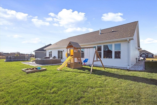 7759 Sunstone Ct, De Pere, WI 54115 - rear view of property featuring an outdoor living space, a playground, a lawn, and roof with shingles