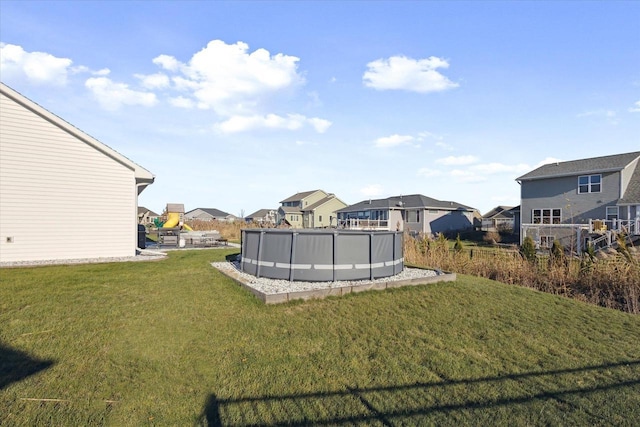 7759 Sunstone Ct, De Pere, WI 54115 - view of grassy yard with a residential view and an outdoor pool