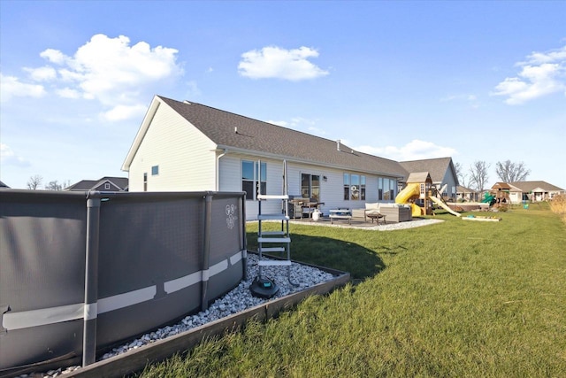 7759 Sunstone Ct, De Pere, WI 54115 - back of property featuring a playground, a lawn, and a patio area