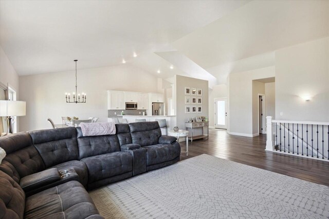 7759 Sunstone Ct, De Pere, WI 54115 - living room featuring a chandelier, dark wood-style flooring, and high vaulted ceiling