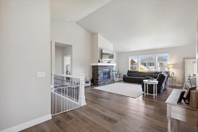 7759 Sunstone Ct, De Pere, WI 54115 - living room with wood finished floors, baseboards, high vaulted ceiling, and a stone fireplace