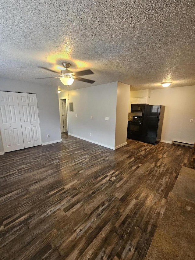 unfurnished living room with ceiling fan, a baseboard radiator, dark hardwood / wood-style floors, and a textured ceiling