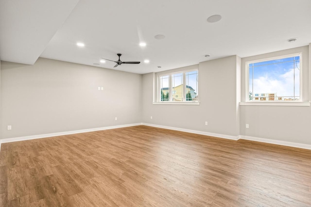 unfurnished room featuring ceiling fan and light hardwood / wood-style flooring