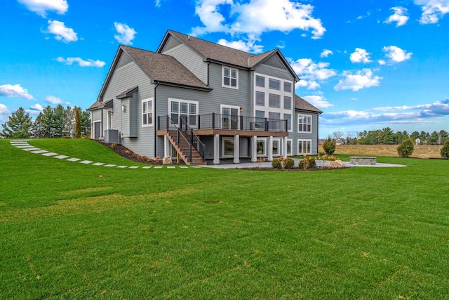 back of property with a lawn, a wooden deck, a patio area, and cooling unit