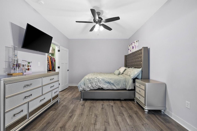 bedroom with ceiling fan and dark hardwood / wood-style flooring