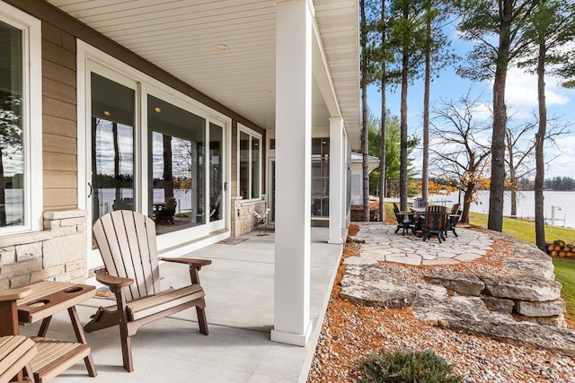 view of patio featuring a water view