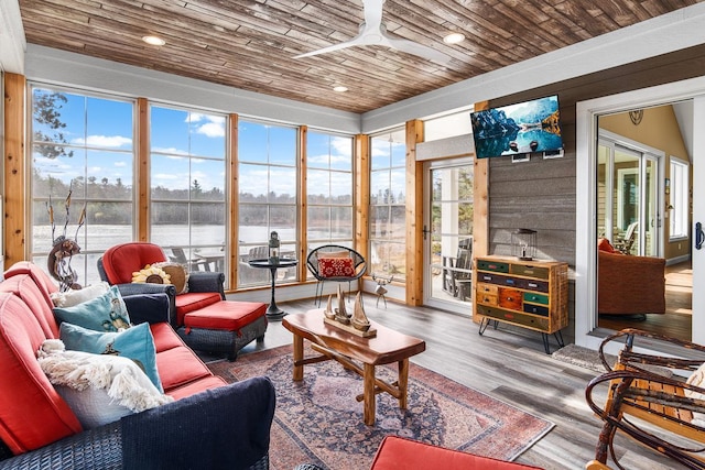 sunroom / solarium featuring wood ceiling and ceiling fan