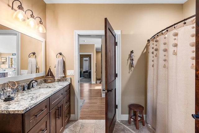 bathroom with vanity, wood-type flooring, and a shower with shower curtain