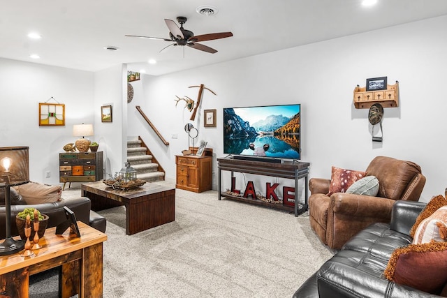 living room featuring ceiling fan and light colored carpet