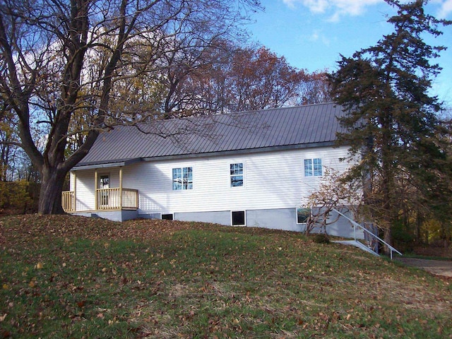 view of side of home featuring a yard