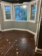 spare room with hardwood / wood-style flooring