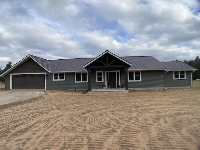 ranch-style home featuring a garage