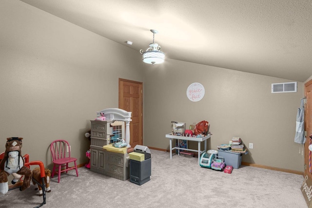 playroom with carpet flooring and vaulted ceiling