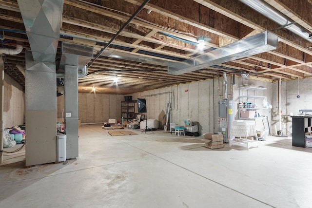 basement featuring heating unit and gas water heater