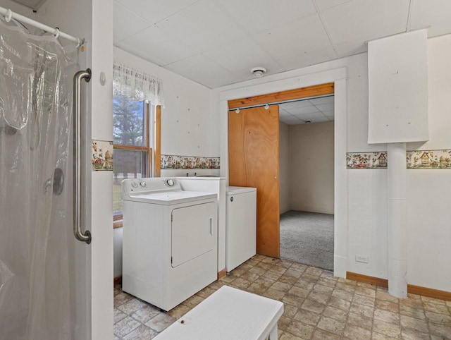 laundry room with washing machine and clothes dryer