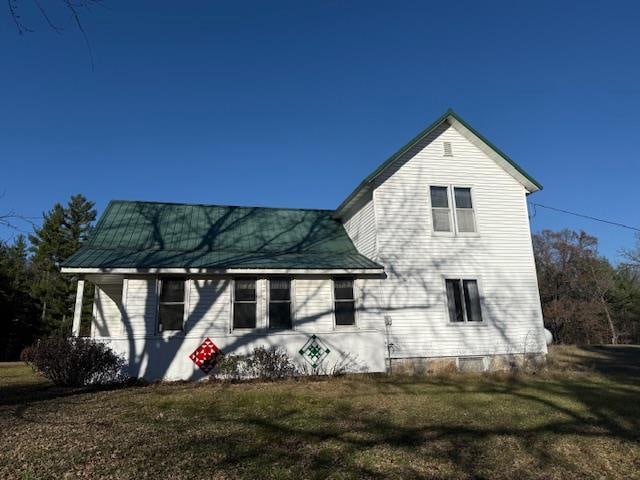 back of house with a yard