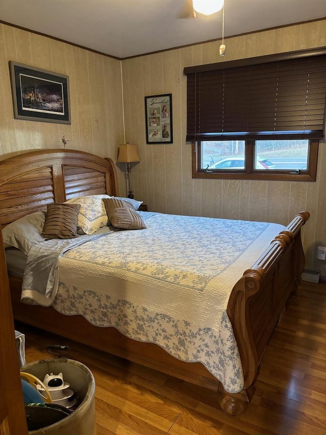 bedroom with wood finished floors