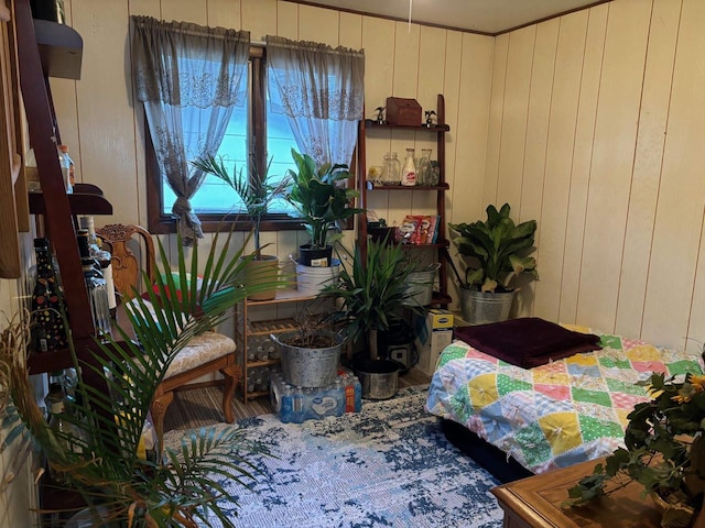 bedroom with wooden walls