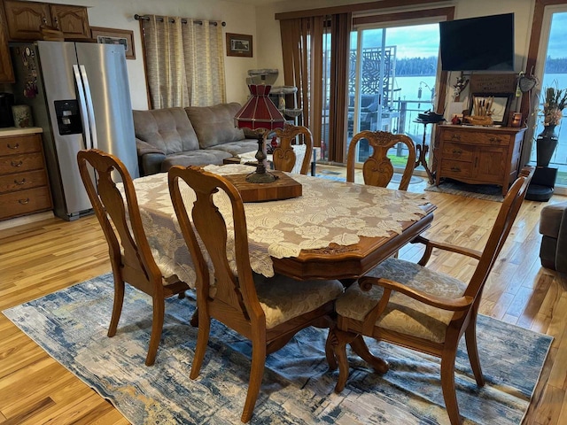 dining area with light wood-type flooring