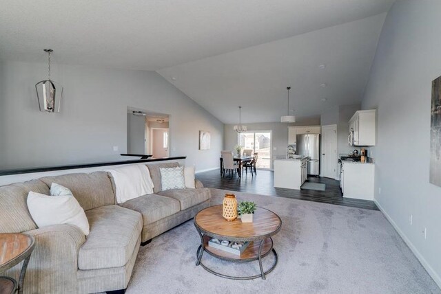 living room featuring vaulted ceiling and dark wood-type flooring