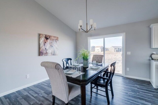 dining space with vaulted ceiling, a chandelier, and dark hardwood / wood-style flooring