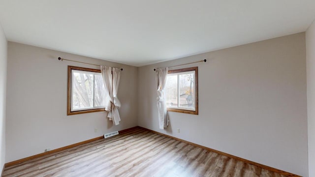 empty room featuring light hardwood / wood-style floors