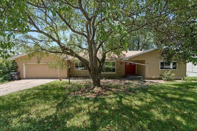 ranch-style house featuring a garage and a front lawn