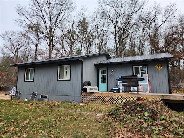 rear view of house with a yard