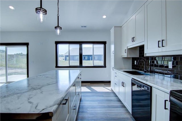 kitchen with black appliances, decorative light fixtures, white cabinets, and sink