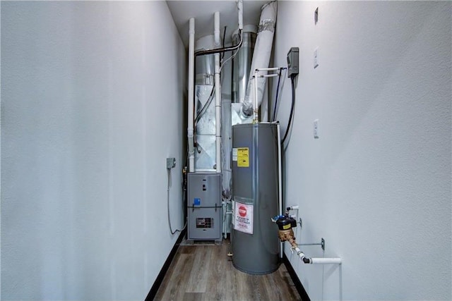 utility room with electric water heater