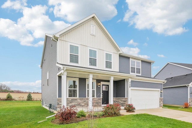 view of front of property featuring a porch, a garage, and a front lawn