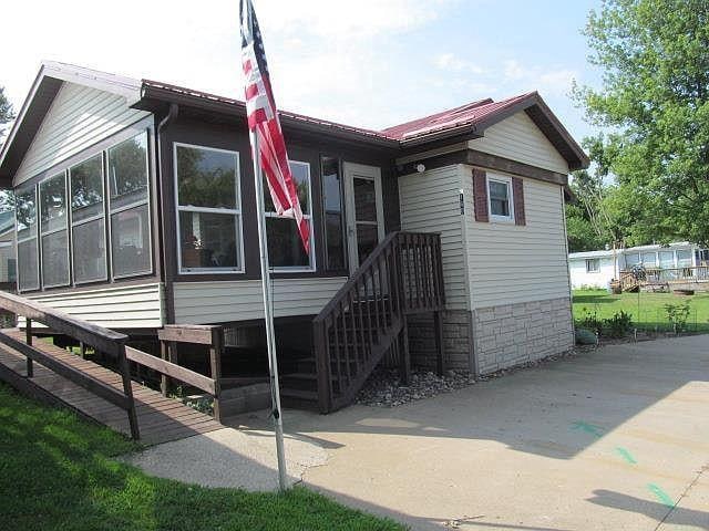 view of side of home with a sunroom