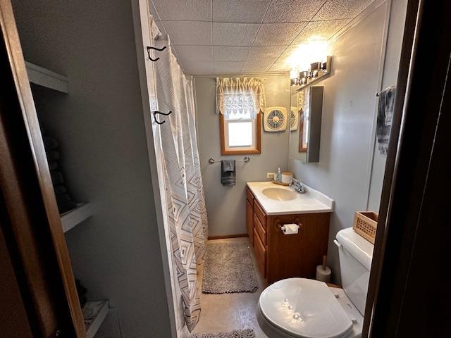 bathroom with tile patterned floors, vanity, and toilet